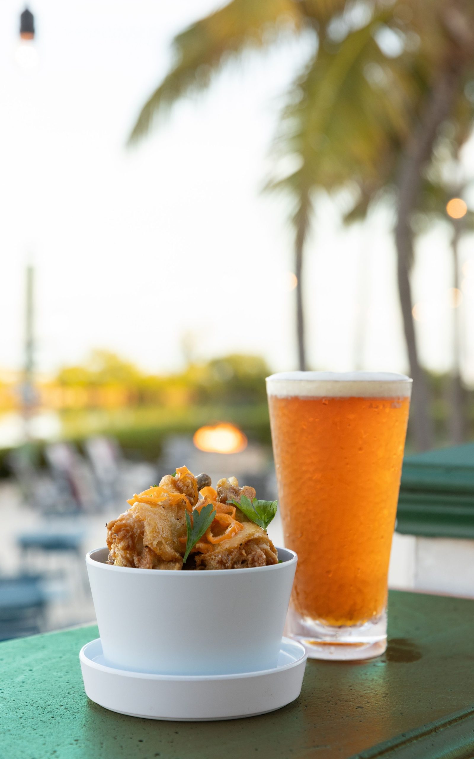 cold beer and lite bites in white ramekin