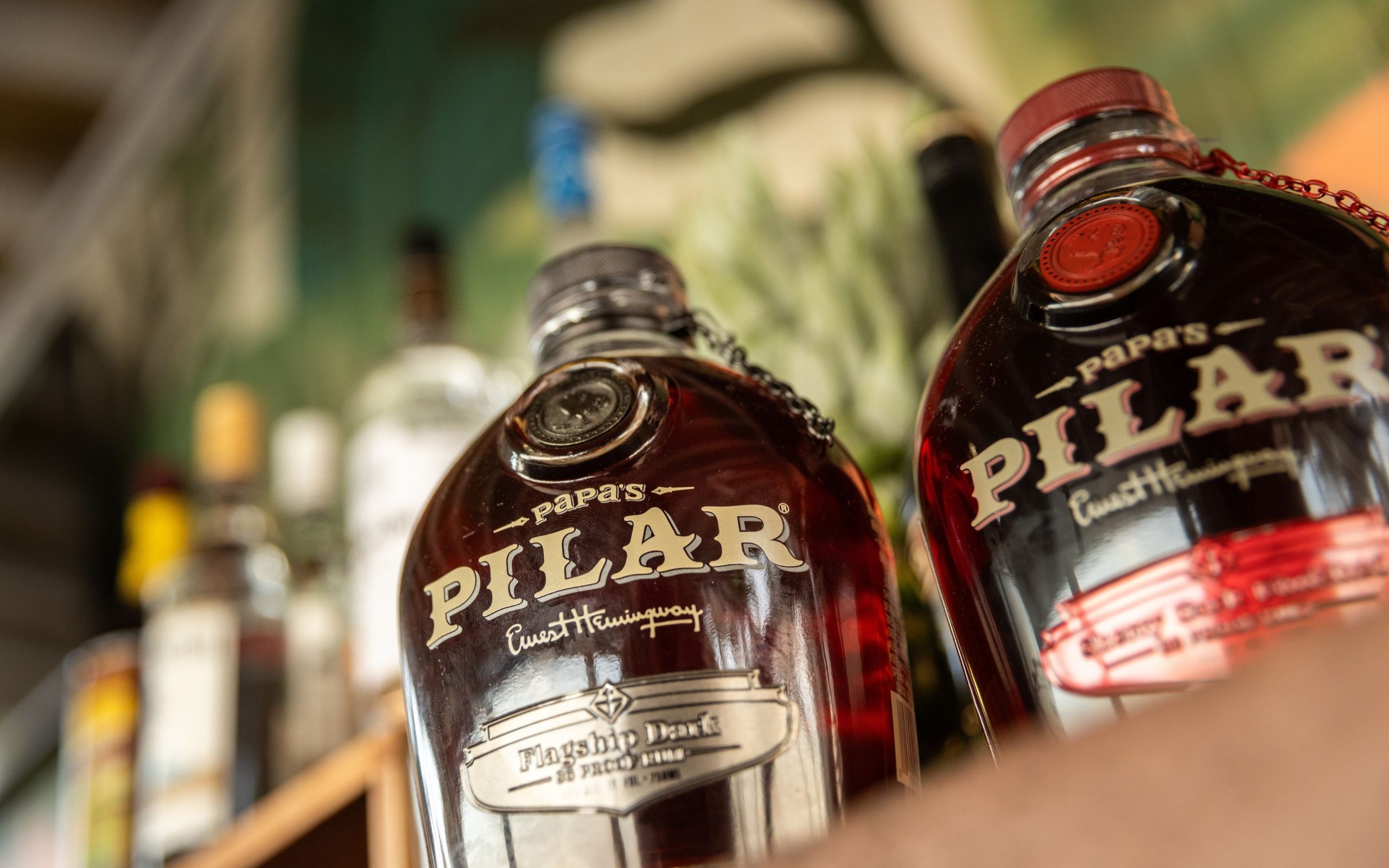 close up of Pilar bottle of rum on bar shelf