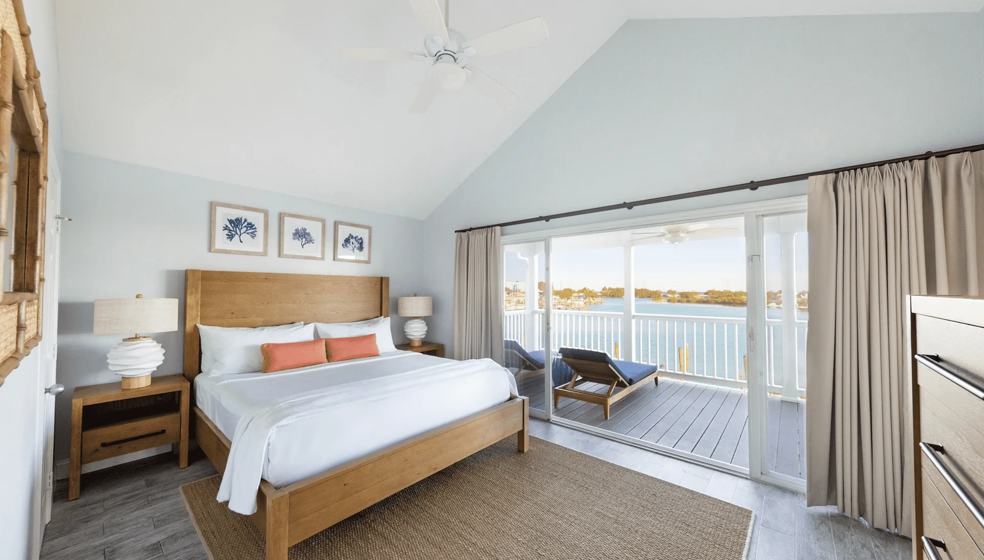 Bright premium three-bedroom villa at Hawks Cay with a king bed and private balcony overlooking the water.